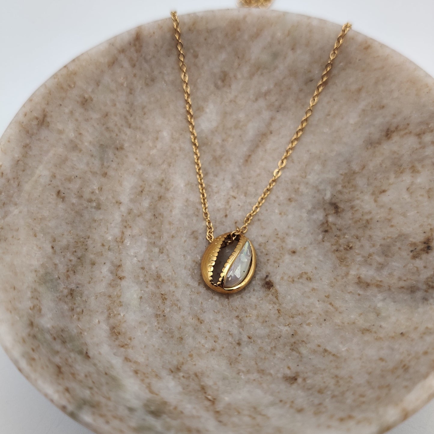 Cowrie shell pendant