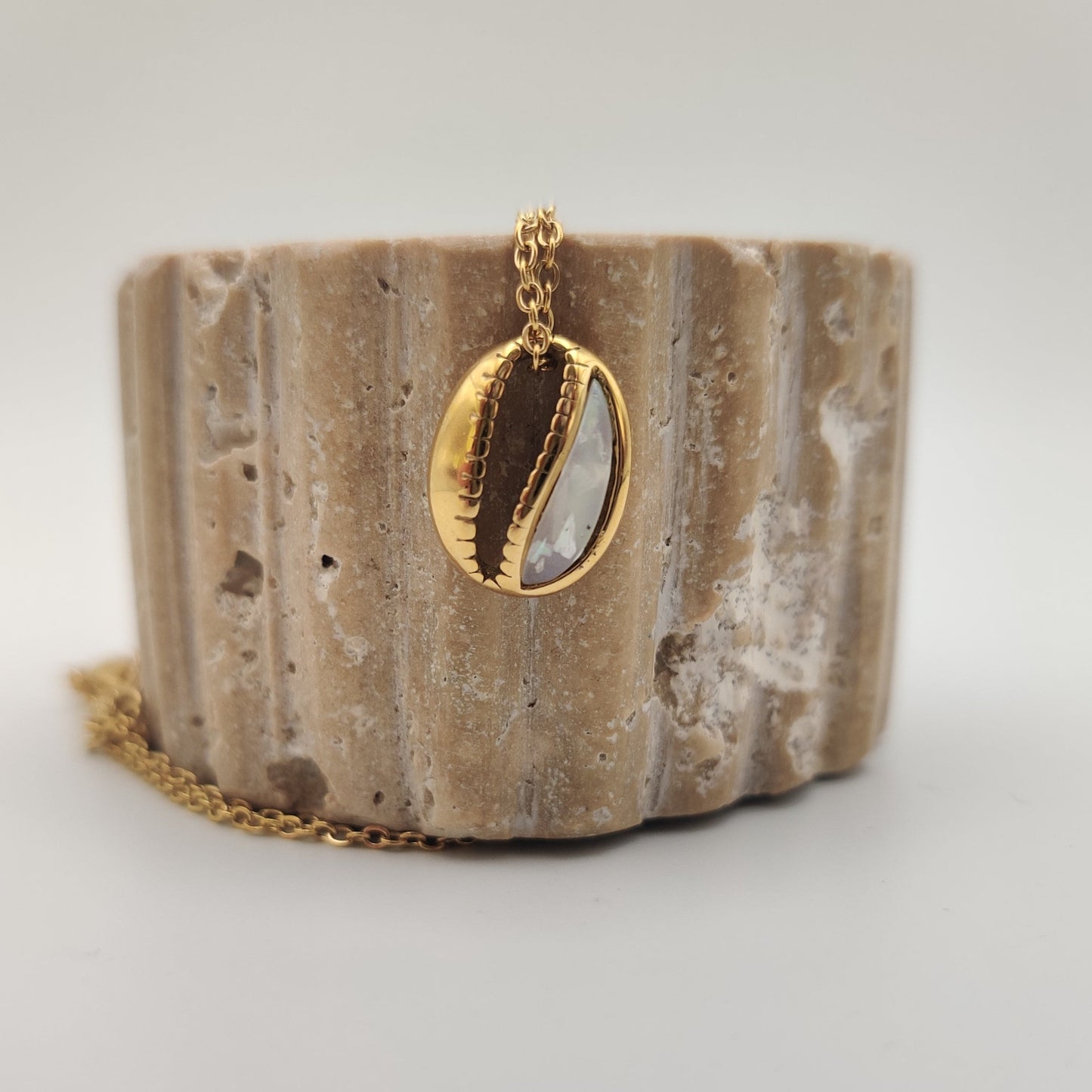 Cowrie shell pendant